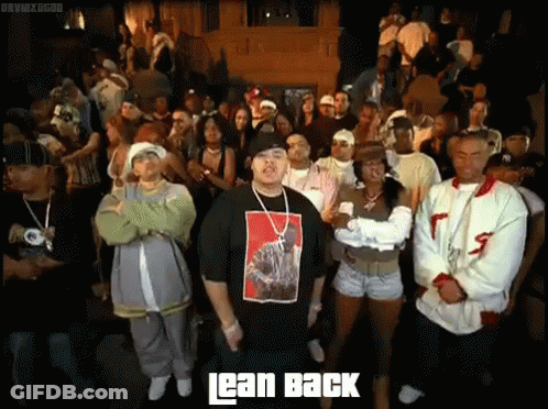 Man In Lean Back Shirt Standing Before Crowd GIF