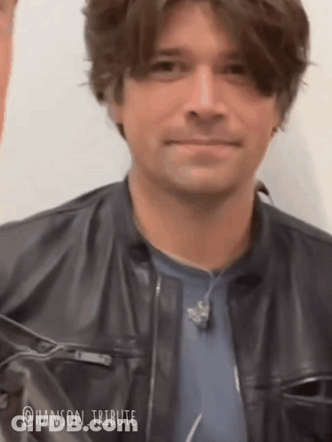 Man In Leather Jacket And Blue Shirt GIF