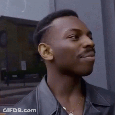 Man In Leather Jacket And Gold Necklace Looking Left GIF