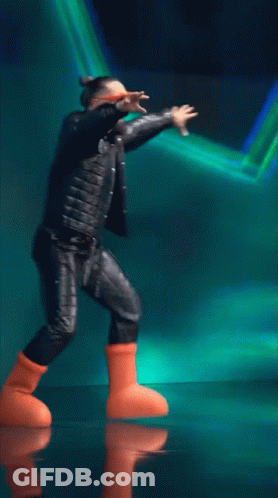Man In Leather Jacket And Orange Boots Dancing GIF
