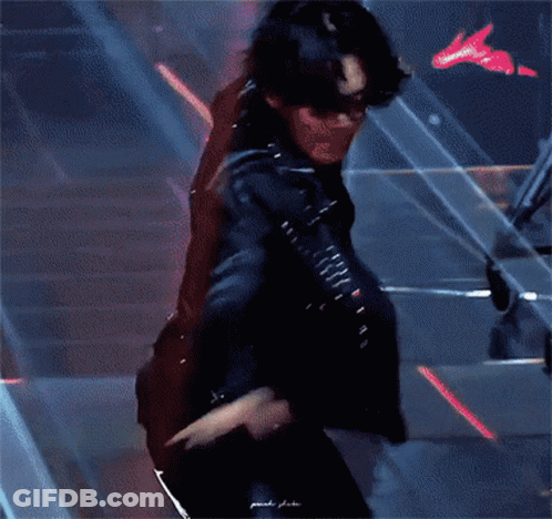 Man In Leather Jacket And Pants Dancing GIF