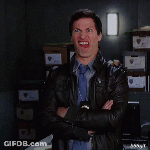 Man In Leather Jacket And Tie Smiling GIF