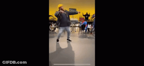 Man In Leather Jacket And Yellow Hat Dancing GIF