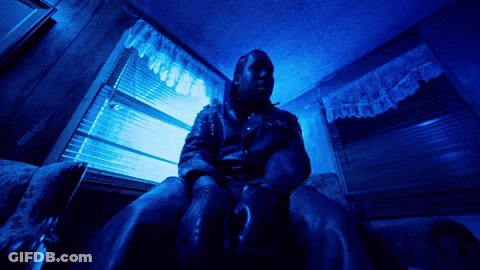 Man In Leather Jacket At Blue Window GIF