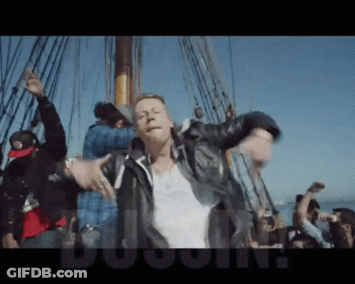 Man In Leather Jacket Dancing On Boat With Crowd Dugout GIF