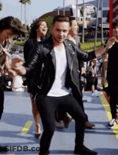 Man In Leather Jacket Dancing With People GIF
