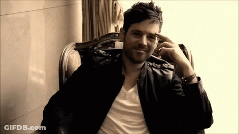 Man In Leather Jacket Hand To Forehead GIF