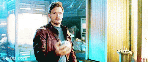 Man In Leather Jacket Holding Ball GIF