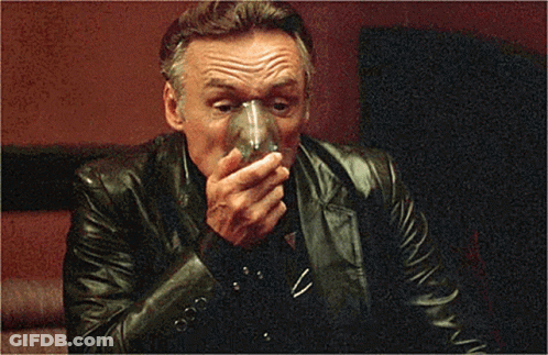 Man In Leather Jacket Holding Glass GIF
