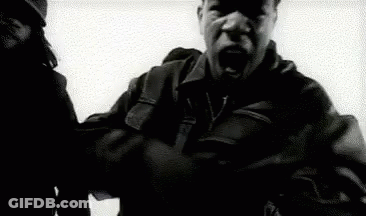 Man In Leather Jacket Holding Gun GIF