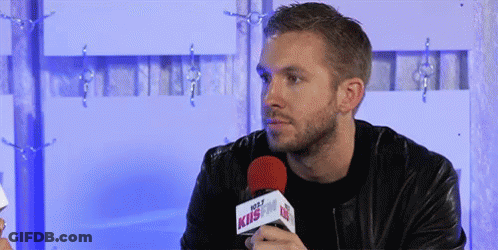 Man In Leather Jacket Holding Hot 107.9 Microphone GIF