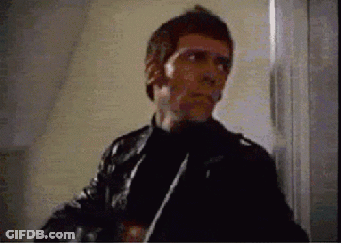Man In Leather Jacket Holding Knife GIF