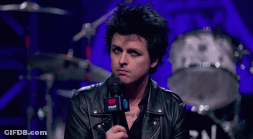 Man In Leather Jacket Holding Microphone GIF
