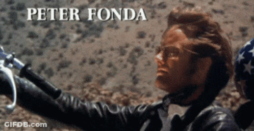 Man In Leather Jacket Holding Motorcycle Handlebars Peter Fonda GIF