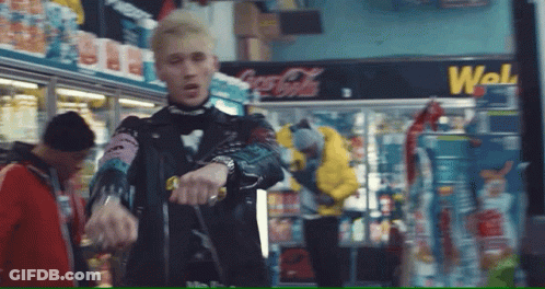 Man In Leather Jacket In Front Of Coca Cola Cooler GIF