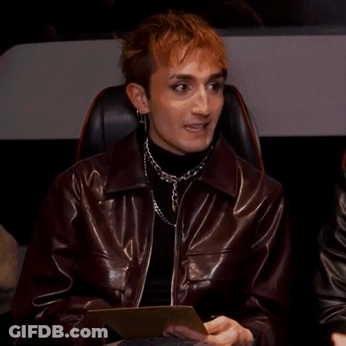 Man In Leather Jacket Interviewed By Woman With Microphone GIF