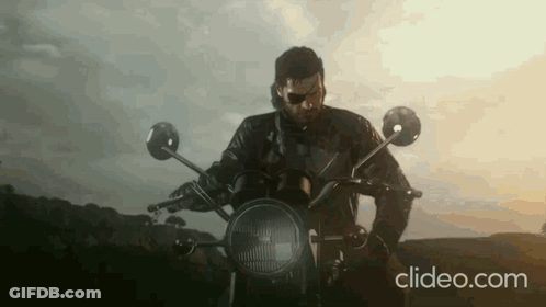 Man In Leather Jacket Riding Motorcycle In Countryside GIF