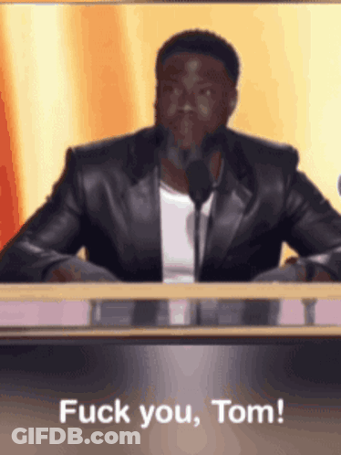 Man In Leather Jacket Saying Fuck You Tom GIF