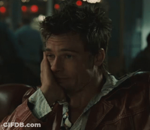 Man In Leather Jacket Sitting Hand On Face GIF