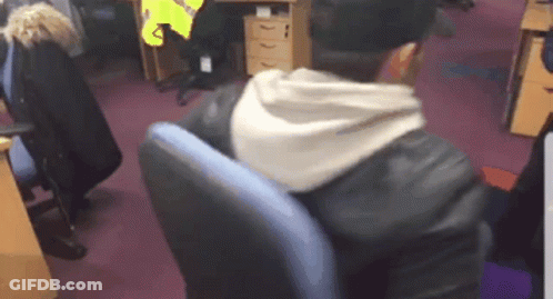 Man In Leather Jacket Sitting In Blue Chair GIF