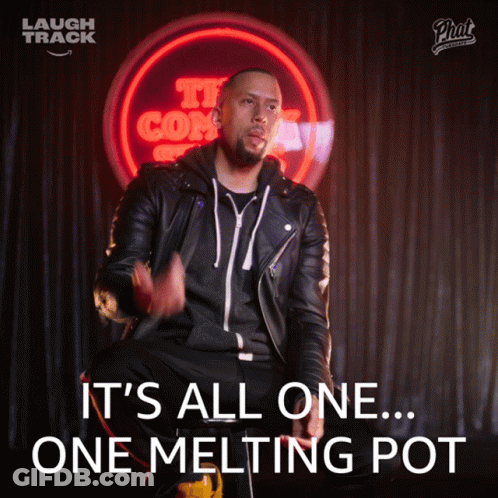 Man In Leather Jacket Sitting In Front Of It's All One Melting Pot Sign GIF