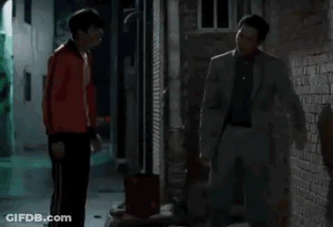 Man In Leather Jacket Sitting With Hand On Face GIF