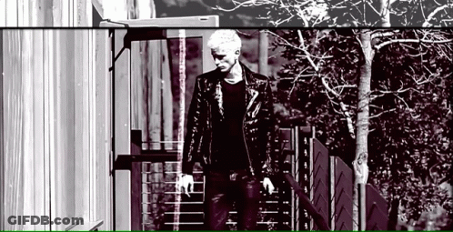 Man In Leather Jacket Walking Down Stairs GIF