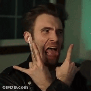Man In Leather Jacket With Devil Horns And Tongue Out GIF