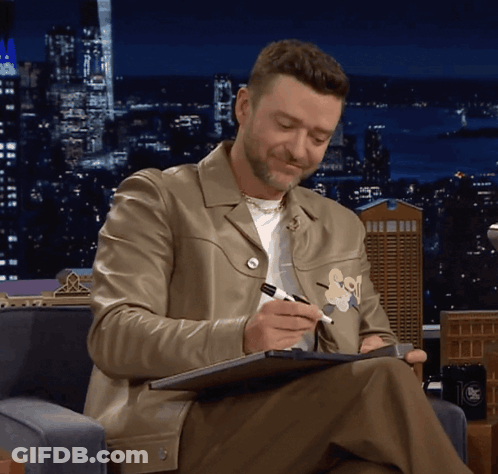 Man In Leather Jacket Writing GIF