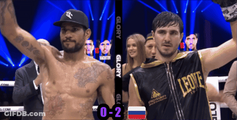 Man In Leone Shirt Next To Boxer In Ring GIF