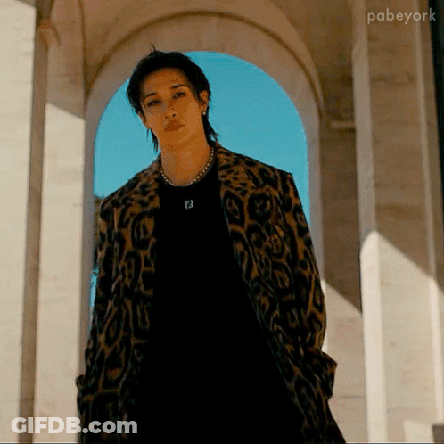 Man In Leopard Print Coat And Black Shirt With Letter F GIF