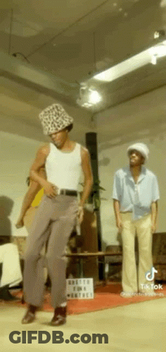 Man In Leopard Print Hat Dancing With Two Men GIF
