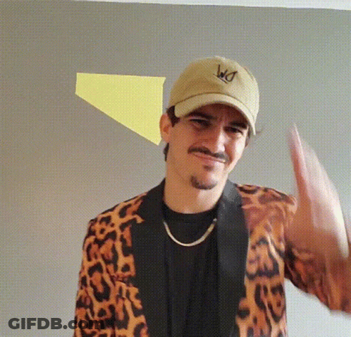 Man In Leopard Print Jacket And WD Hat GIF