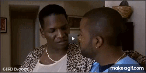 Man In Leopard Print Jacket Talking To Another Man GIF