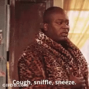 Man In Leopard Print Robe Saying Cough Sniffle Sneeze GIF