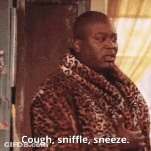 Man In Leopard Print Robe Sneezing At Door GIF