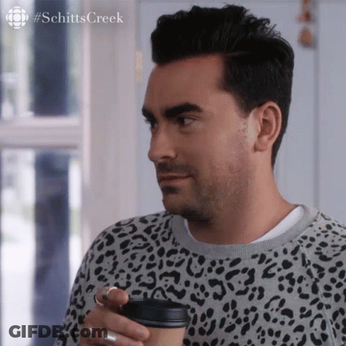 Man In Leopard Print Sweater Holding Coffee GIF