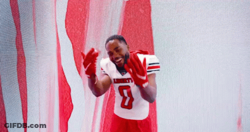 Man In Liberty Football Jersey In Front Of American Flag GIF