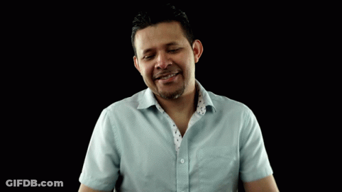 Man In Light Blue Shirt Making Funny Face GIF