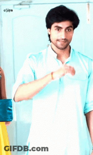 Man In Light Blue Shirt Next To Man In Blue Shirt And CJIYA Sign GIF