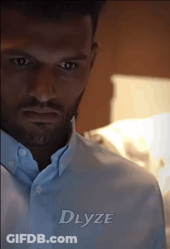 Man In Light Blue Shirt With Dlyze GIF