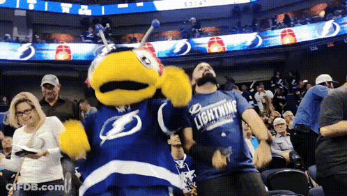 Man In Lightning Shirt Dancing With Mascot GIF