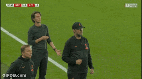 Man In Liverpool Sweatshirt Shaking Hands GIF