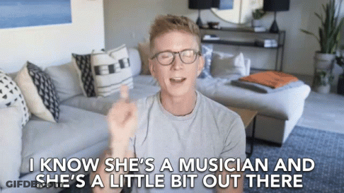 Man In Living Room Saying She's A Musician GIF