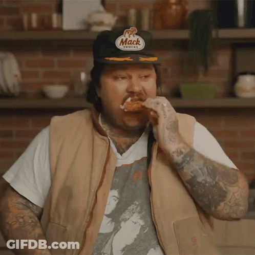 Man In Mack Hat Eating Chicken Wing GIF