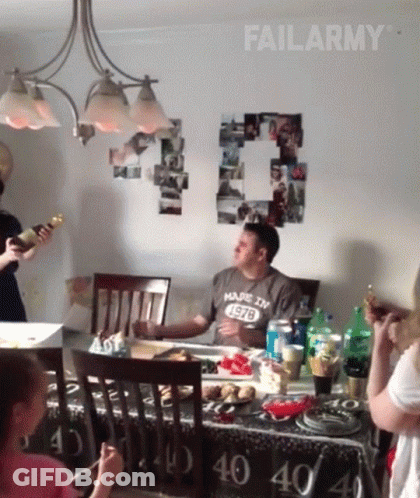 Man In Made In 1978 Shirt Sitting At Table GIF