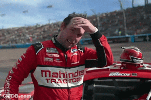 Man In Mahindra Tractors Jacket Wiping Face GIF