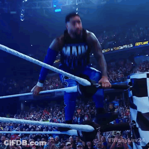 Man In Main Event Shirt Jumping Into Wrestling Ring GIF