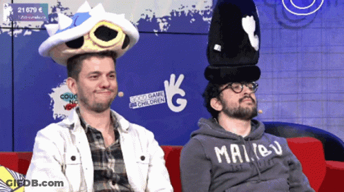 Man In Malibu Hoodie On Red Couch GIF