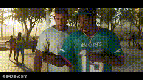 Man In Manatees Jersey Looking At Phone GIF